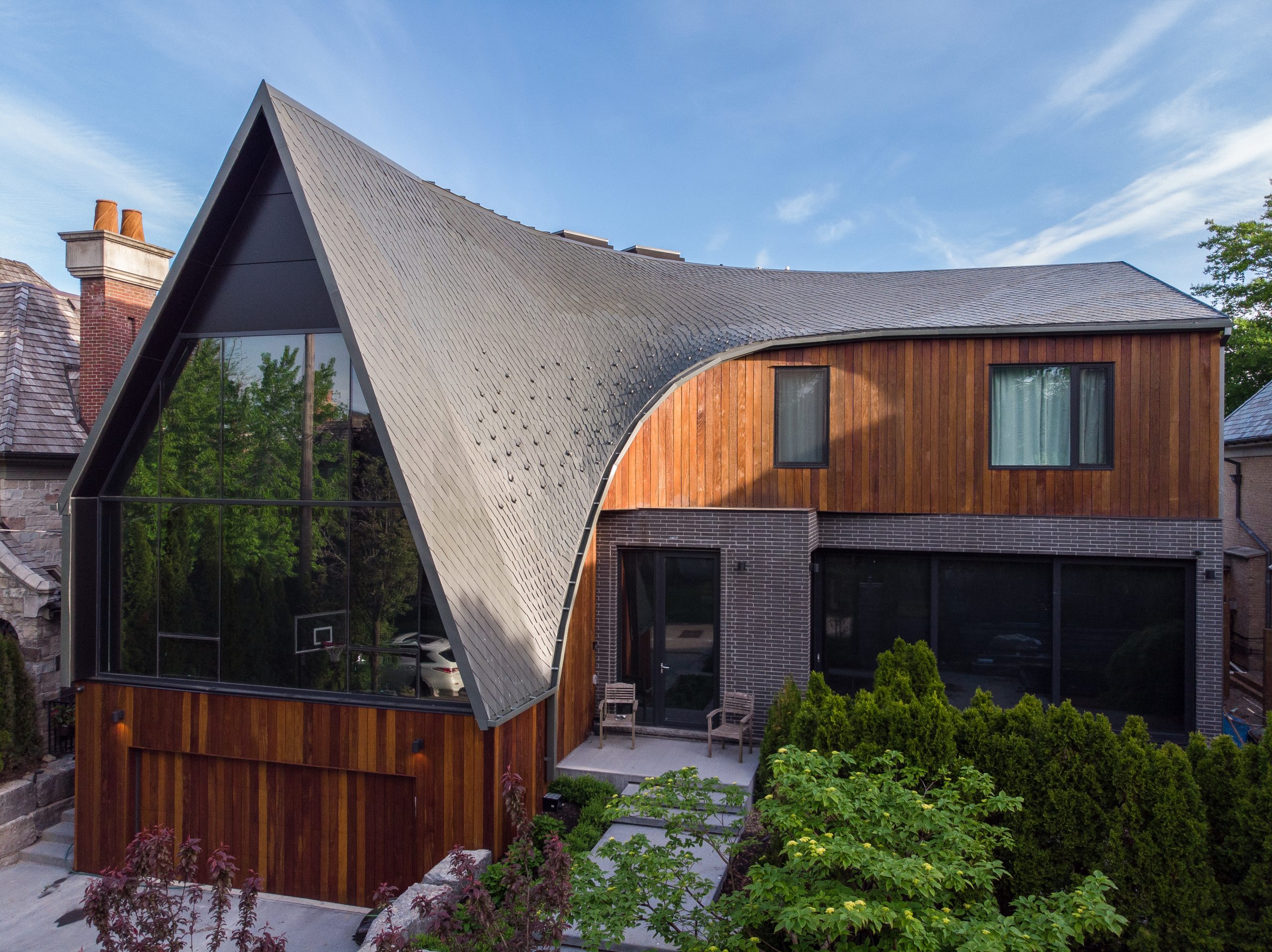 Roofing With Imagination: A-frame Gets a Dragon-Scale Topper