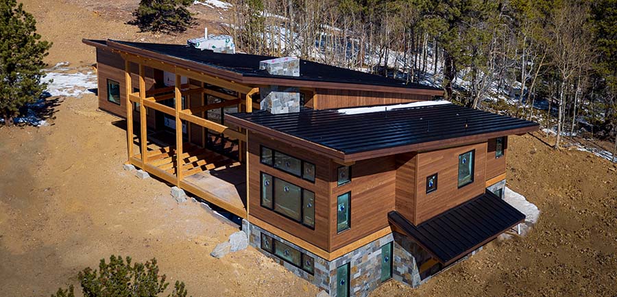 Residential Project Involves Rolling Roof Panels on Mountainside Site