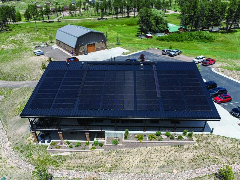 The metal roof of the S-5! corporate office is designed to allow for a 15% gap at the eave between the solar array and the snow retention system.
