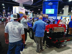 New Tech Machinery showed off its next-generation SSQ III MultiPro Roof and Wall Panel Machine, outfitted with an attention-grabbing Stars & Stripes wrap.