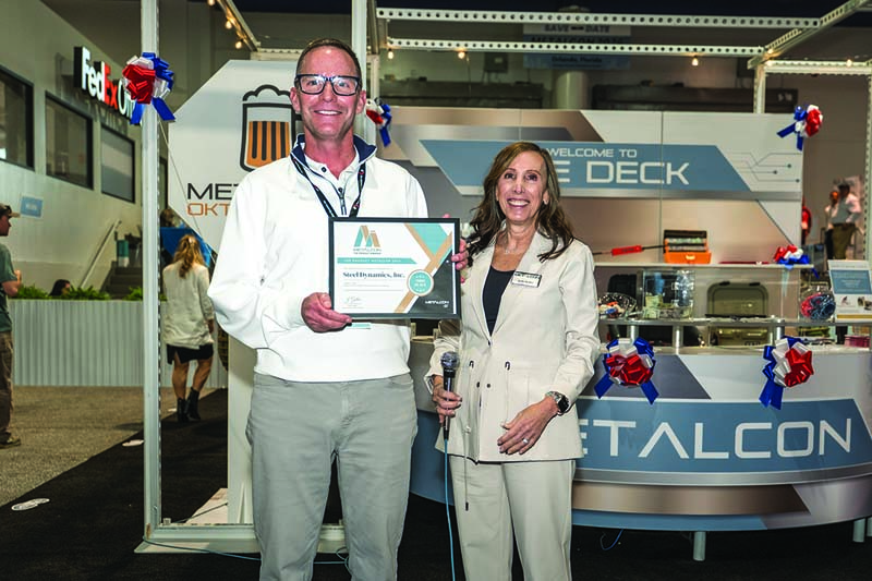Judy Gellar presents the third place Top Product Award to Steel Dynamics for its TruGrain made with Tru-Steel HD. Award photos courtesy of Neubek Photographers.