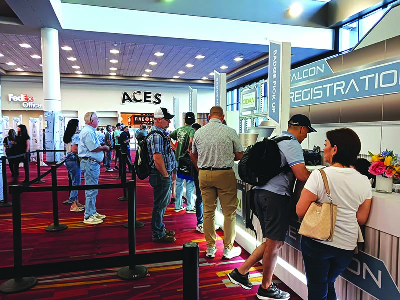  A steady stream of attendees filed through the Registration area at METALCON 2025.