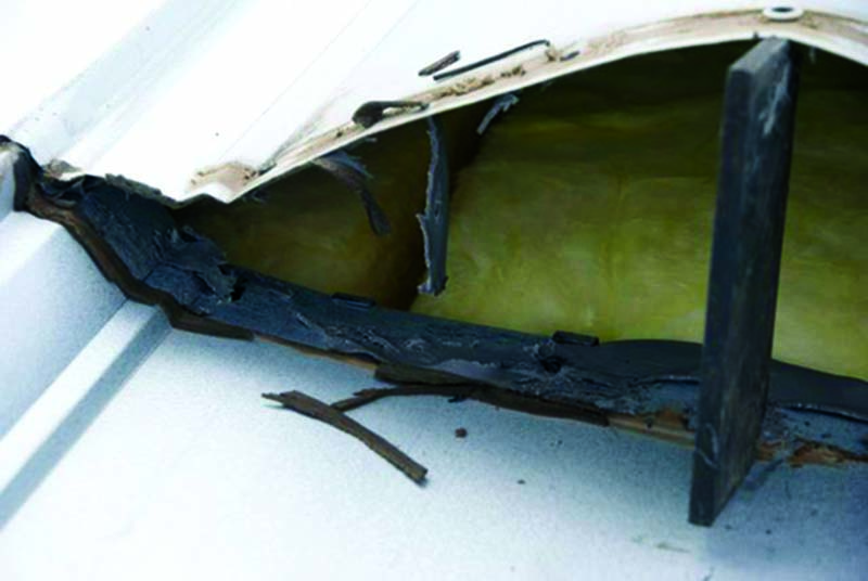Figure 2:  A “Brand X” butyl sealant failure at 5-7 years’ service. Photo courtesy of Rob Haddock, Metal Roof Advisory Group, Ltd