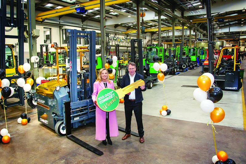 Winner Kareen Farrell travelled to Combilift’s headquarters in Monaghan to receive the one-of-a-kind 100,000th Combi-CBE “Golden Forklift.”