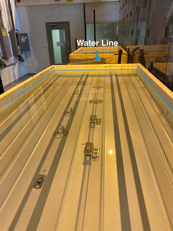 Figure 7: ASTM E2140 test of S-5!®  components (Water Penetration of Metal Roof Panel Systems by Static Water Pressure Head). The joint is submersed under a 6” static water head for 6 hours. If it leaks a single drop, it fails. Photo courtesy of S-5!